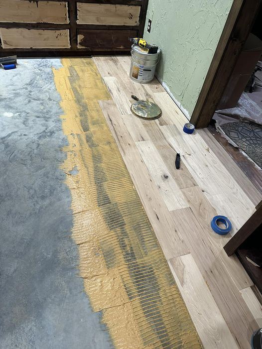 Hand-scraped hickory floor glued down over a concrete slab