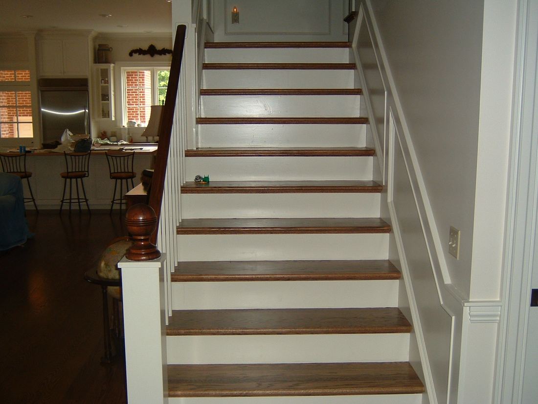 Staircase with hardwood treads and white risers